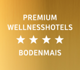 Weiße Schrift auf goldenem Hintergrund "Premium Wellnesshotels 4 Sterne Bodenmais" | © Bodenmais Tourismus & Marketing GmbH